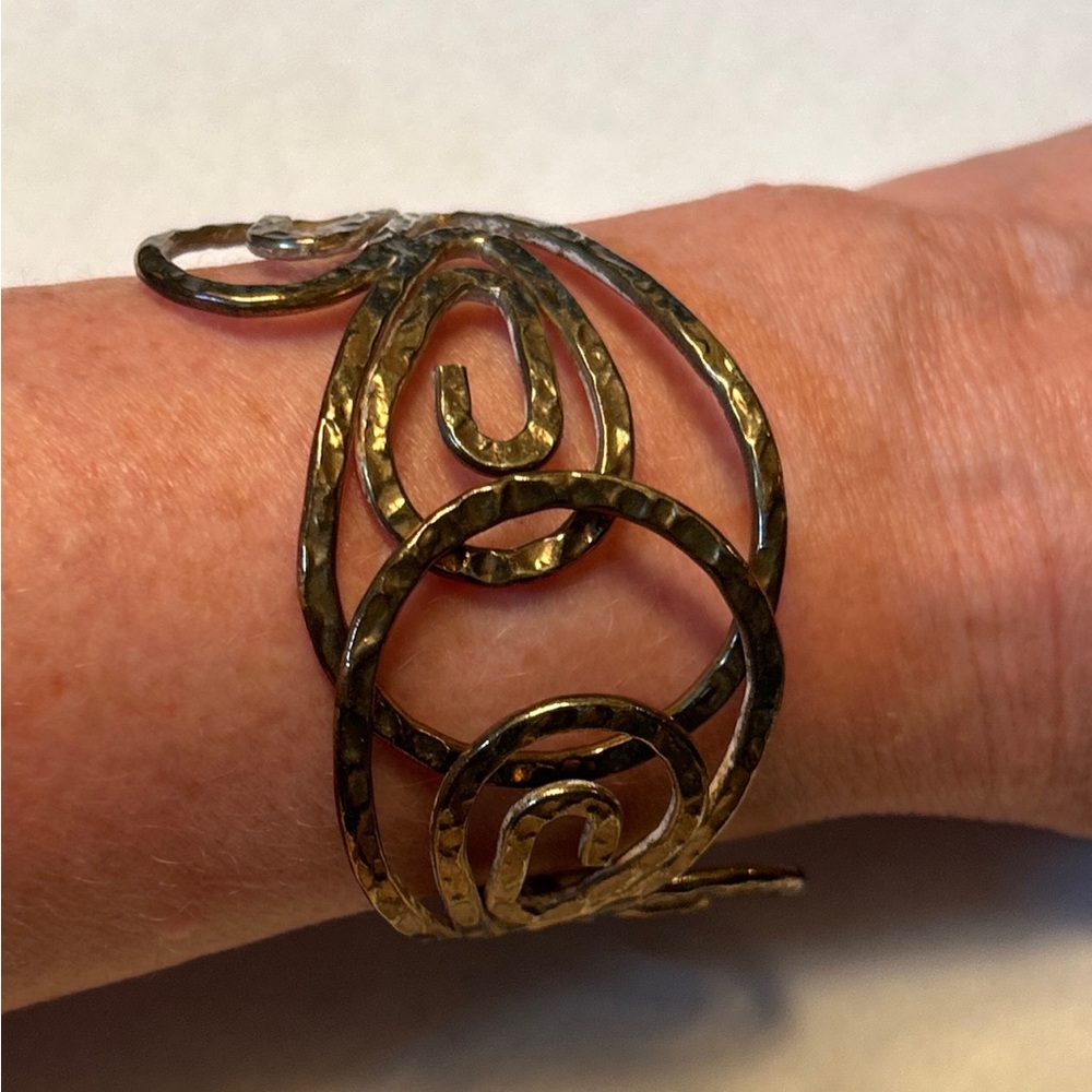 70s Cuffed Bracelet in Hammered Spiral Scroll Design. Hinged. Gold-Toned. GUC.